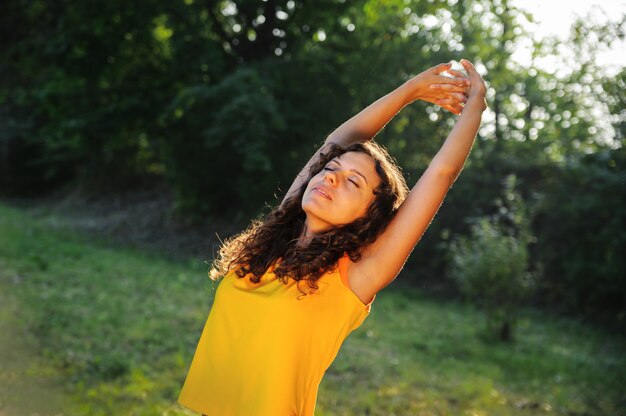 Woman standing with closed eyes