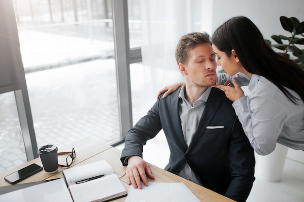 Woman stands close to guy