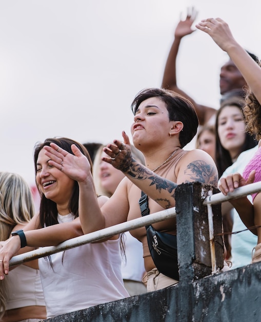 Woman in the stands tense during a sports match Vertical photo