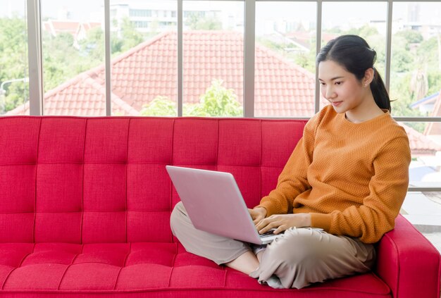 Woman stay home using notebook