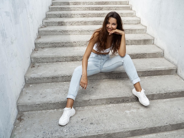 Woman on steps in city street outdoors