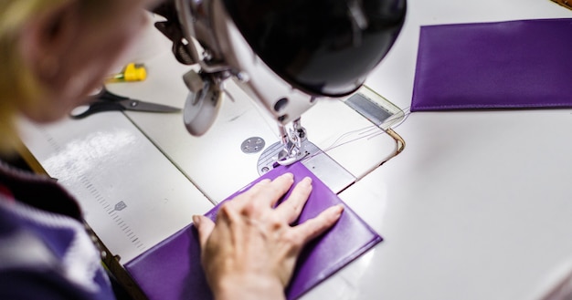 Woman stitching a purse