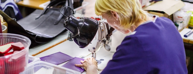 Woman stitching a purse