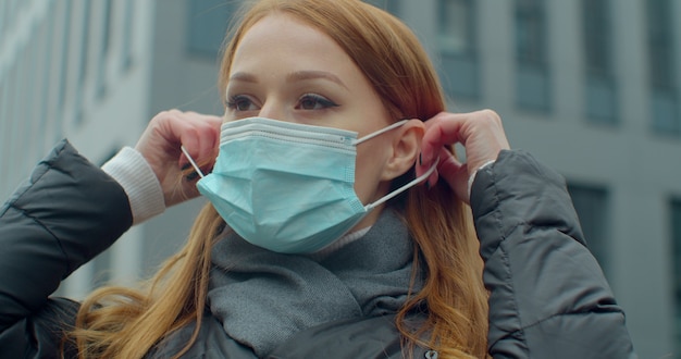 Woman on street wearing face protection in prevention for coronavirus covid 19.