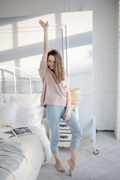 Woman stretching after a night sleep