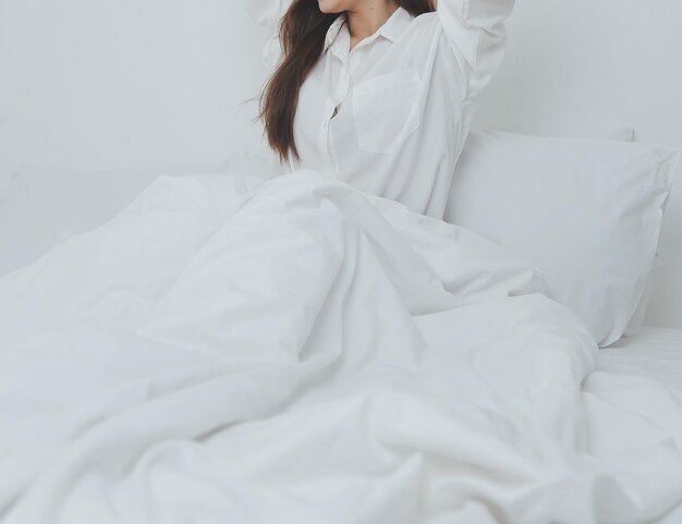 Woman stretching in bed after wake up