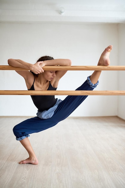 Woman Stretching at Dance Bar