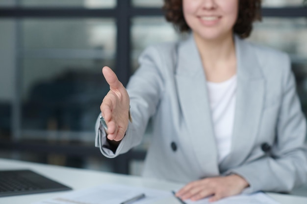 Woman stretching her hand for handshake