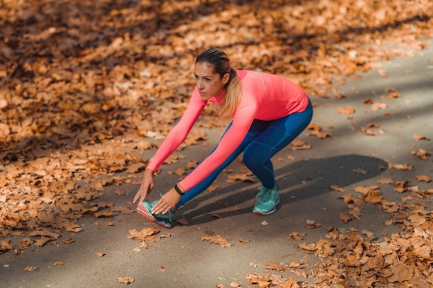 Woman Stretching in the Park