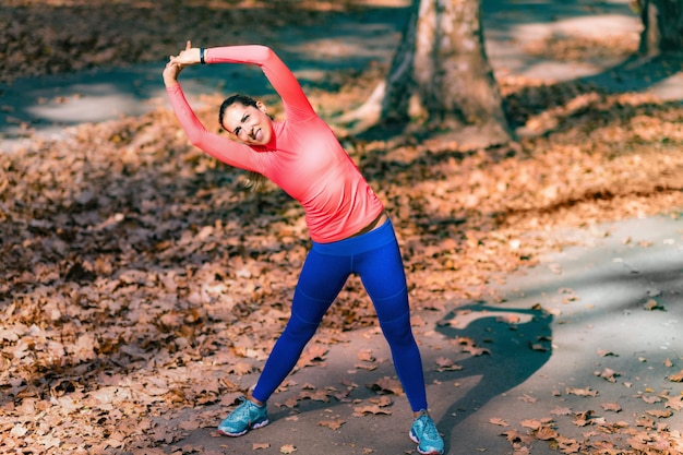 Woman Stretching in the Park