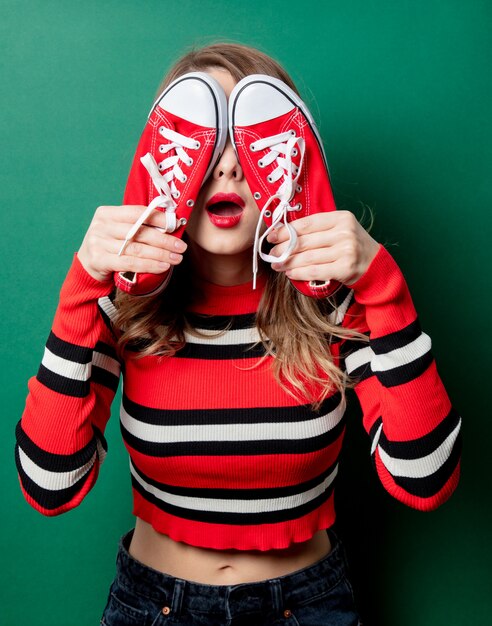 Woman in striped sweater with gumshoes