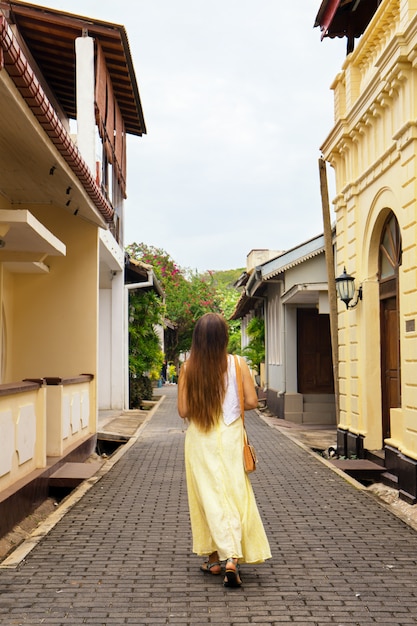 A woman strolls through the city of Halle