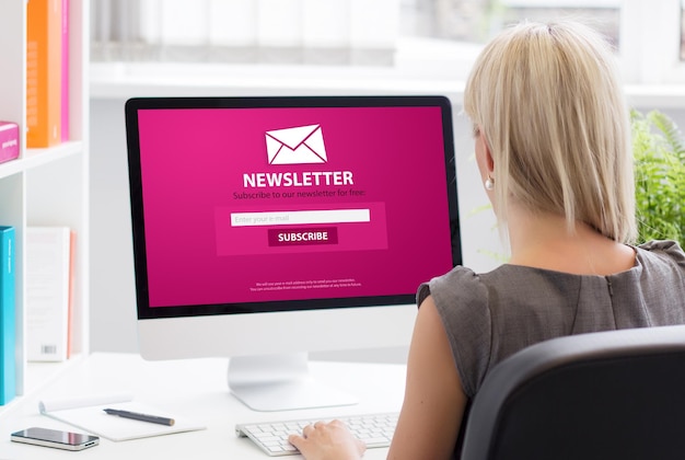Woman subscribing to newsletter on some website