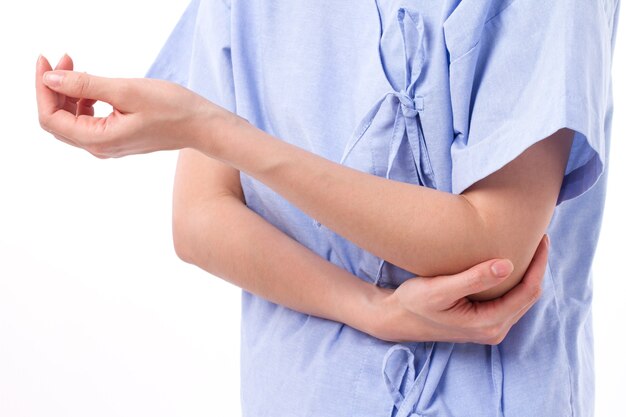 Woman suffering from elbow joint injury