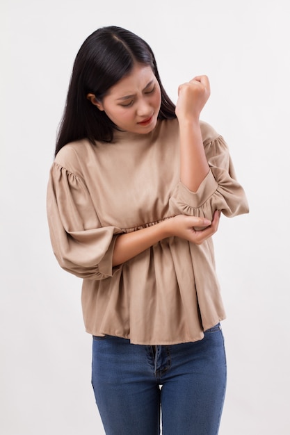 Woman suffering from elbow joint pain, rheumatoid or gout arthritis