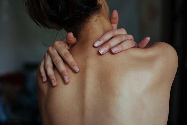 woman suffering from neck ache