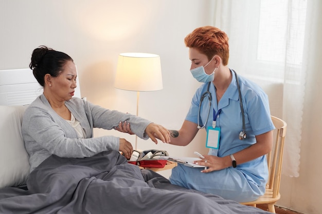 Woman Suffering from Pain in Left Arm