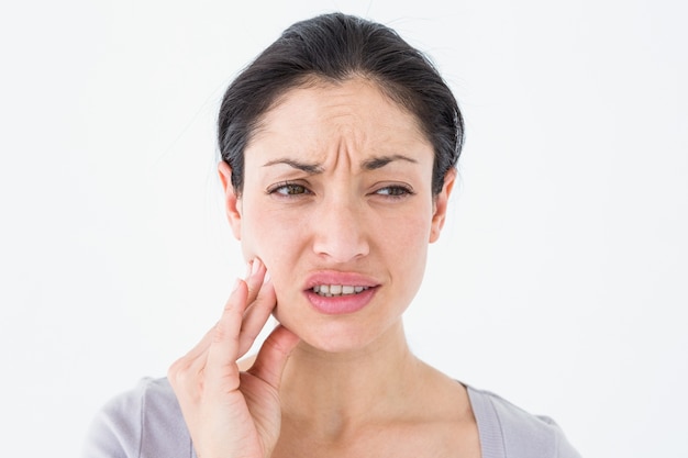 Woman suffering from teeth pain 