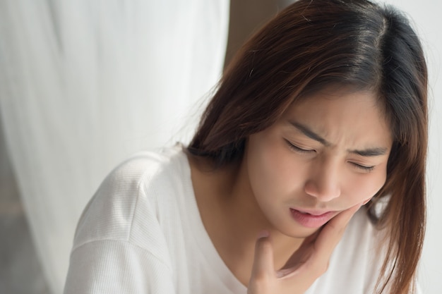 Woman suffering from toothache