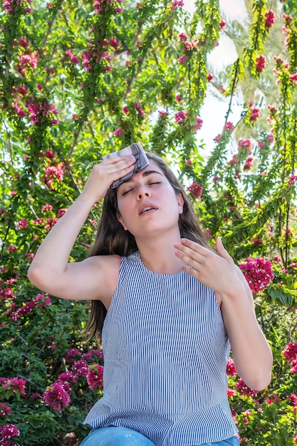 Woman suffering a heat wave at park