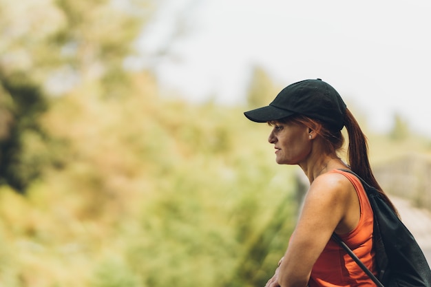 Woman in summer clothes looking the landscape in nature