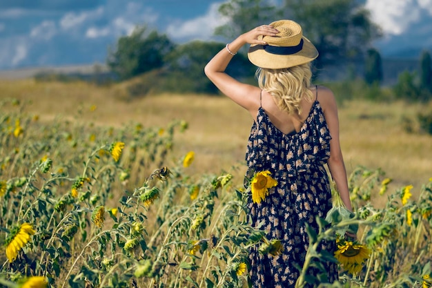 Woman In A Sunflower Field on summer