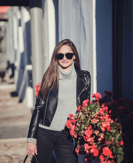 Woman in sunglasses and leather jacket 