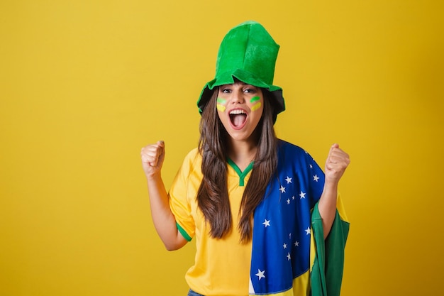 Woman supporter of brazil world cup 2022 screaming goal\
celebrating partying amazing