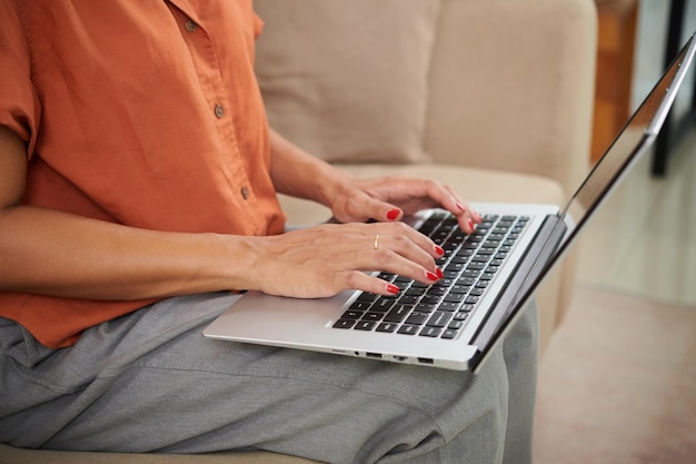 Woman surfing the net on laptop