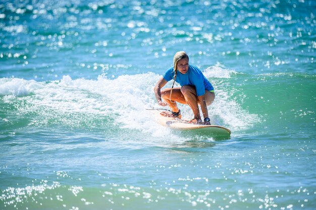 Woman surfing in sea