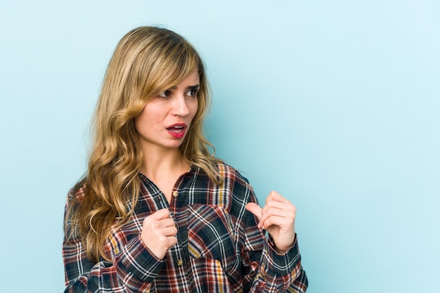 Woman surprised pointing with fingers