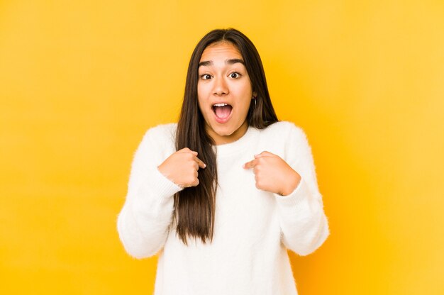 Woman surprised pointing with fingers