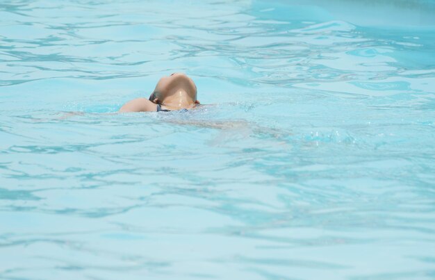 Woman swimming in pool