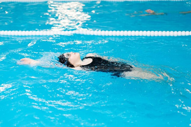 Woman swimming in pool