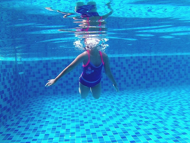 Woman swimming in pool