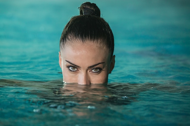 Woman swimming in pool