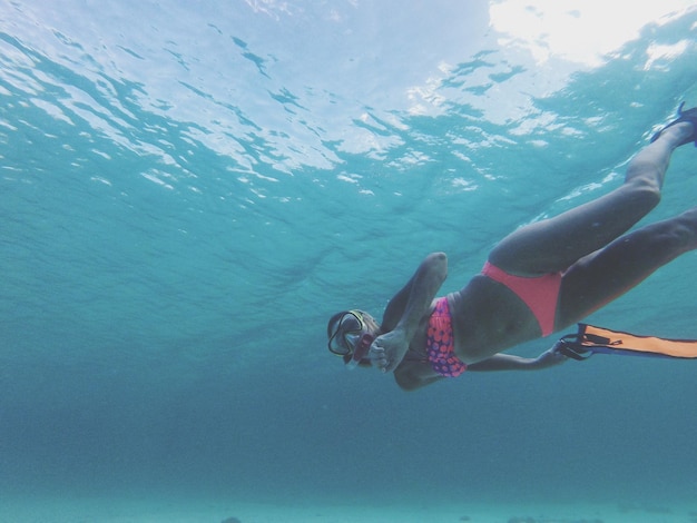 Woman swimming in sea