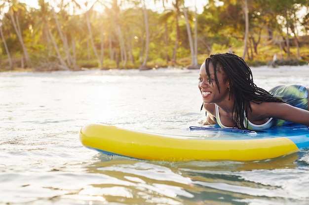 Woman swimming on sup board