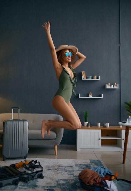 Woman in swimsuit represent herself on beach