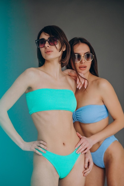 Woman in swimwear isolated in studio on background