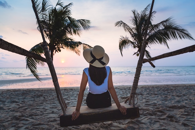 Woman on swing in beach