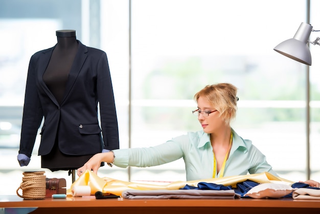 Woman tailor working on new clothing