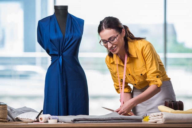 Woman tailor working on new clothing