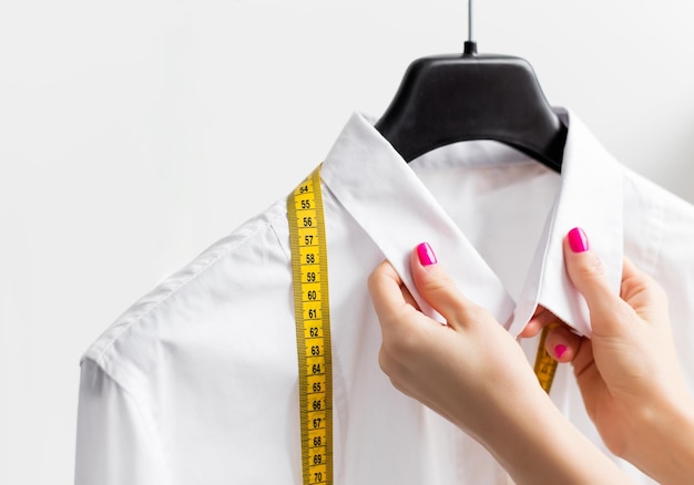 Woman tailoring business shirt