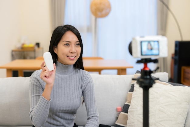 Woman take footage for social media of selling product