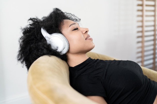 A woman takes a break listening to calm music with headphones harmony and balance relieves stress