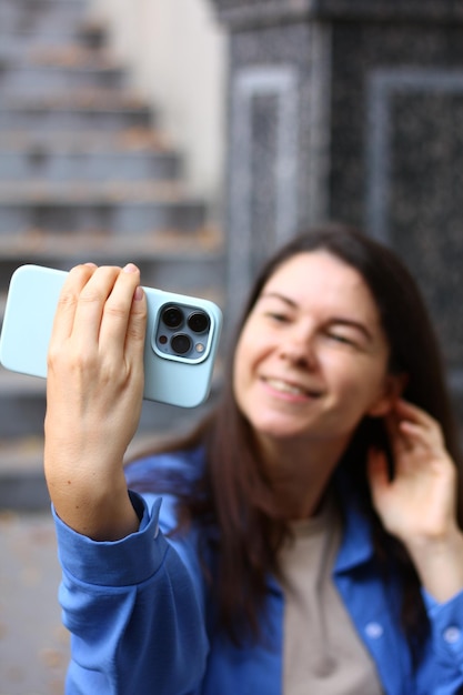  Premium Photo | Woman takes a photo on the phone a selfie