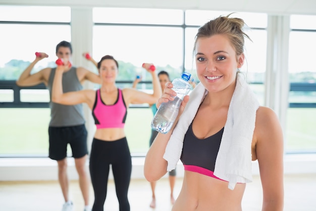 Woman taking break from aerobics class