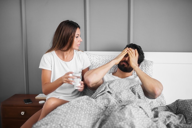 Woman taking care of her sick husband.