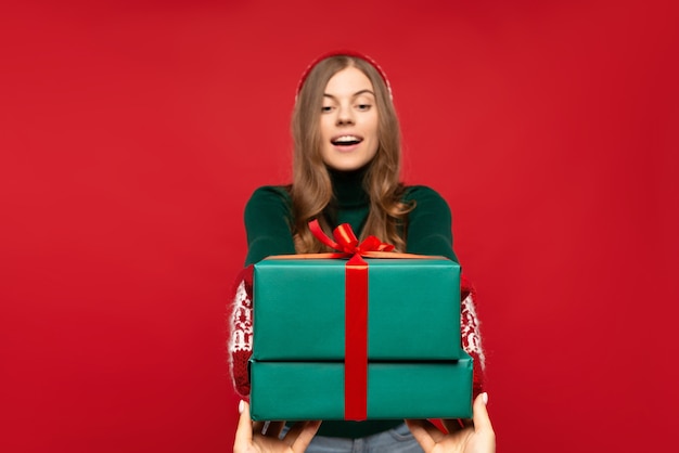 Woman taking Christmas present isolated